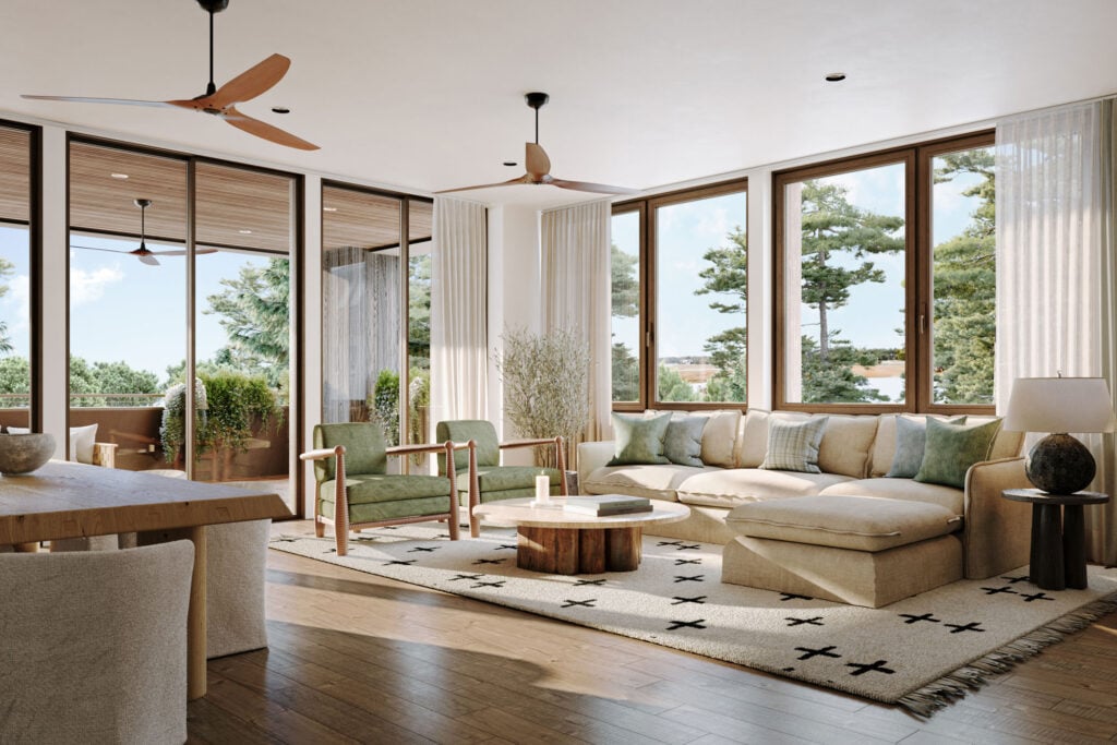 Elegant coastal-style living room with neutral furnishings and expansive glass doors opening to a balcony in a Kiawah Island luxury rental.